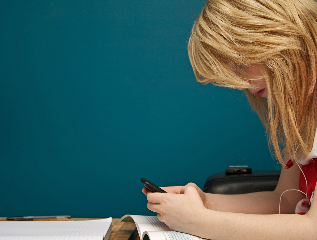 Girl using a mobile app to learn English